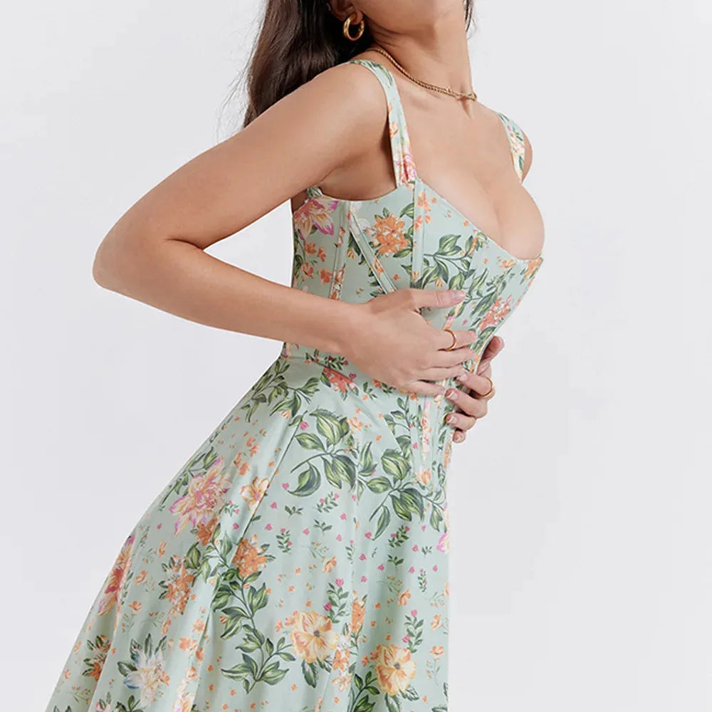 Modelo usando vestido midi verde con corset floral, ideal para boda civil o eventos primaverales.